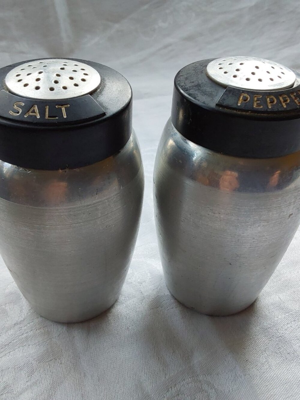 Retro Kromex salt and pepper shakers spun aluminum and bakelite